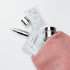 Rosa toilettaske fyldt op med Bioeffect produkter